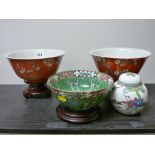 Pair of red ground floral painted Hong Kong bowls on stands, a Famille Vert Chinese bowl and a