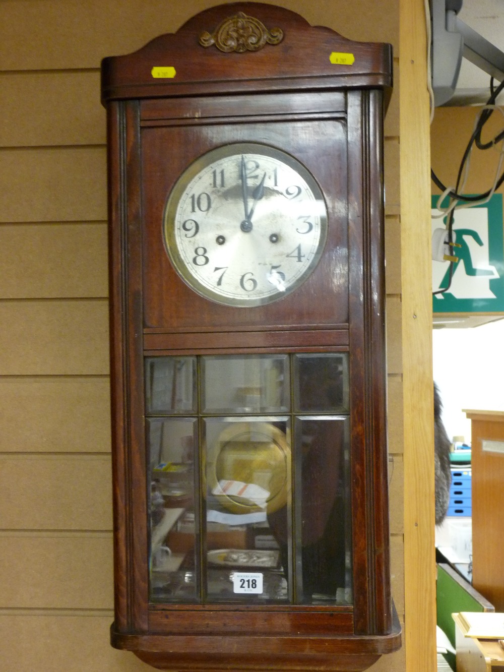 Pendulum wall clock with silvered dial and six bevelled glass panels