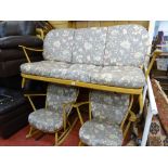 Light Ercol lounge suite of three seater settee and a pair of rocking armchairs, all matching