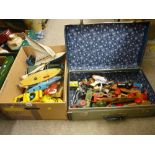 Box of vintage pond yachts, toy submarines and vehicles along with a vintage suitcase of toy