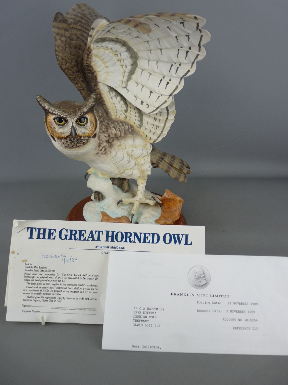 1988 Franklin Mint model of a great horned owl on a circular wooden base