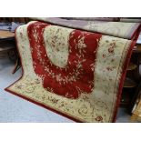 A large red & gold patterned rug