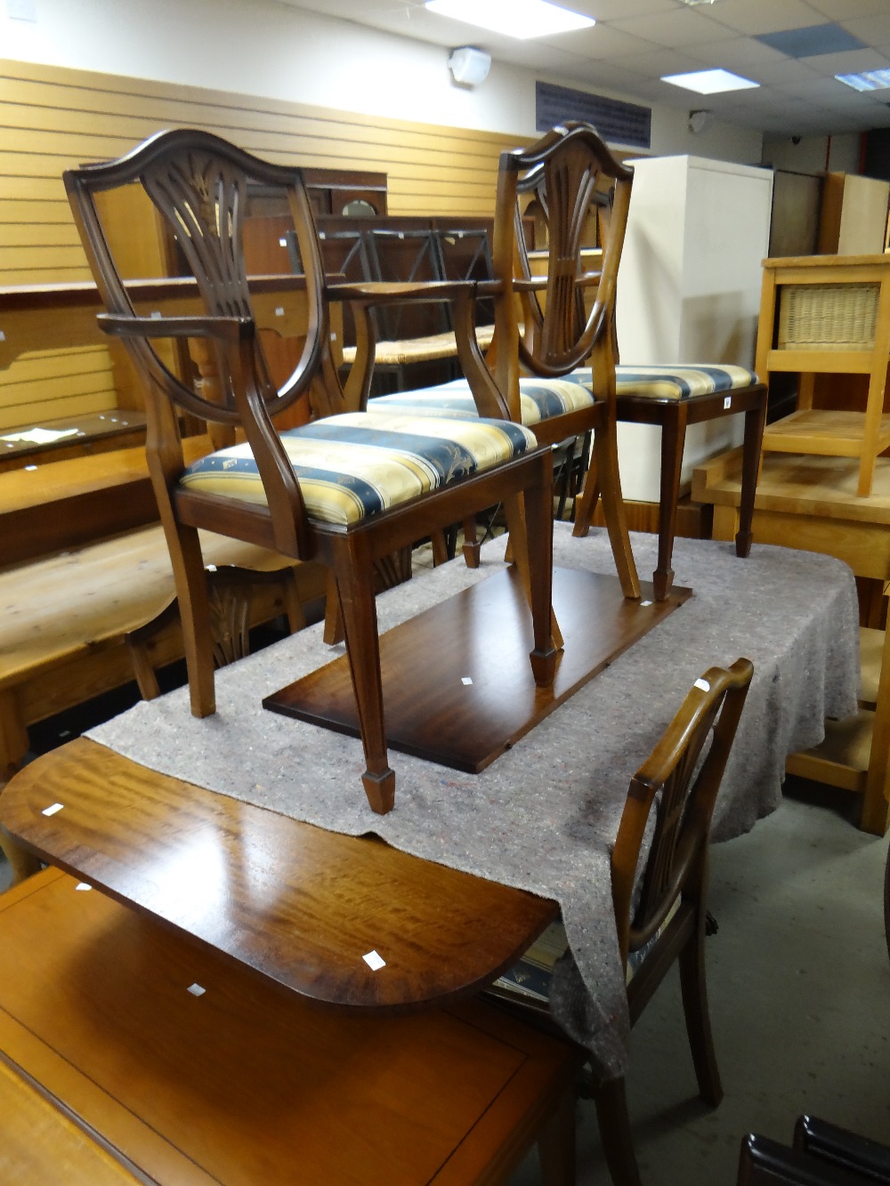 A good reproduction mahogany twin-pedestal dining table & six chairs including two carvers Condition