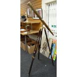 A vintage telescope on a tripod stand Condition reports are provided on request by email only for