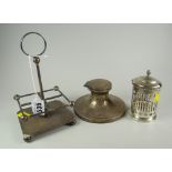A square based silver four-bottle stand together with a hallmarked silver circular based inkwell &