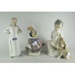 A Lladro figure of a child in nightdress with puppy & two further infant Lladro figures Condition
