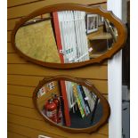 Two oval mirrors in lightwood frames Condition reports are provided on request by email only for