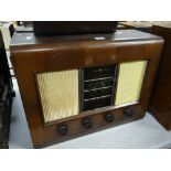 A Bush vintage veneer encased radio Condition reports are provided on request by email only for this