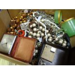 A quantity of costume beads & a yellow metal compact travel clock ETC Condition reports are provided