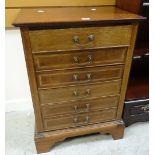 An antique inlaid mahogany six-drawer music cabinet Condition reports are provided on request by
