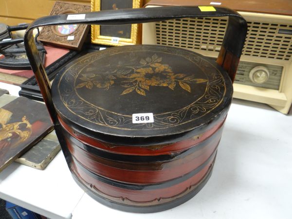 An Oriental lacquered food container Condition reports are provided on