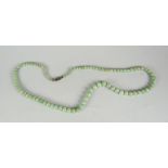 A strand of jade beads Condition reports are provided on request by email only for this type of