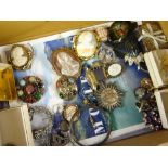 A box of mixed jewellery including brooches, marcasite items, Scottish-type brooch, silver backed