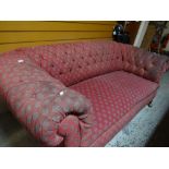 A vintage Chesterfield settee in motif fabric (distressed), 202cms wide Condition reports are