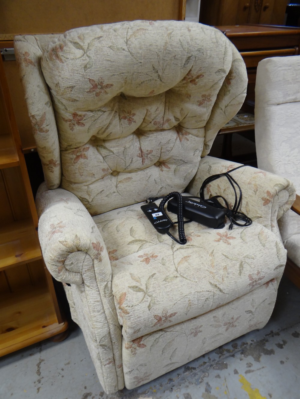 A modern Celebrity electric recliner armchair with floral upholstery Condition reports are