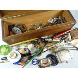 A wooden box containing small collectables including whistle, badges, pens ETC Condition reports are