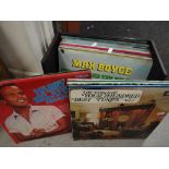 A box of vinyl records including Max Boyce, Jim Reeves, Shirley Bassey & other Welsh themed
