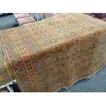 Rust ground antique Persian carpet with geometric motif patterns, 221 x 149cms