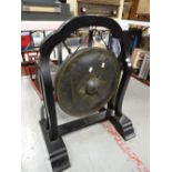 An Eastern-style dinner gong & stand Condition reports are provided on request by email only for