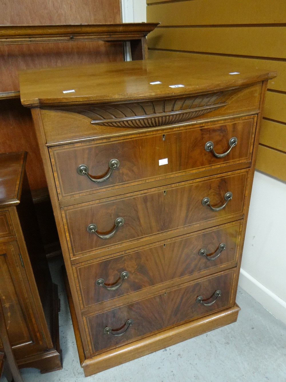 A good quality inlaid mahogany four-drawer chest, 104cms high Condition reports are provided on