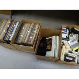 A collection of vinyl records, cassette tapes & books Condition reports are provided on request by