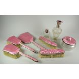 An eight-piece silver & pink Guilloche enamel dressing table set Condition reports are provided on