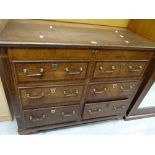 A nineteenth century crossbanded oak & mule chest of six drawers with brass fittings, 109cms wide