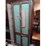 A vintage painted kitchen cupboard with character adaptations Condition reports are provided on