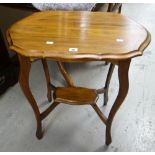 A two-tier antique mahogany occasional table with shaped top Condition reports are provided on