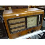 An Ekco vintage radio in a veneered case Condition reports are provided on request by email only for