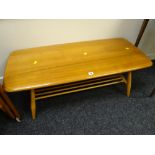 A good Ercol blonde two-tier Long John coffee table Condition reports are provided on request by
