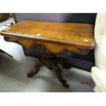 A good antique walnut foldover card table with carved spider base & carved frieze, 92cms wide