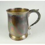 A plain silver bell-shaped mug, with later presentation inscription to base, London 1930, 12.3oz