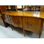 A reproduction mahogany serpentine sideboard together with two similar style lounge units