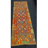 A vegetable dye wool Choli Kelim runner, 245 x 77cms Condition reports are provided on request by