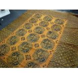 A large mustard ground antique Persian carpet, 260 x 345cms