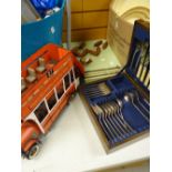 A cased part set of cutlery & a skittles game together with a model of an open top vintage bus