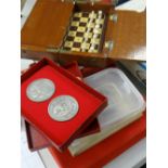 A vintage travel chess set, sundry 1972 Chess Olympics medallions, a 1972 Olympiad for chess
