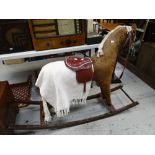 A late twentieth century felt covered child's nursery rocking horse Condition reports are provided