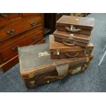 A large vintage canvas suitcase & three smaller vintage cases Condition reports are provided on