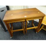 An AH McIntosh mid-century teak nest of tables, the parent being fold-over Condition reports are