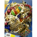 Large quantity of costume beads, bangles ETC Condition reports are provided on request by email only