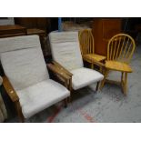 A pair of lightwood cushioned armchairs & a pair of hoop back pine kitchen chairs Condition