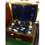 An antique rosewood cased vanity set complete with leather outer case Condition reports are provided