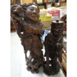 Two Oriental carved wooden figures Condition reports are provided on request by email only for