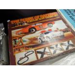 A Dukes of Hazzard Electric Slot Racing set in original box Condition reports are provided on