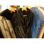 A collection of four full length fur coats together with a vintage full length knitted coat