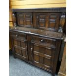 A Priory or similar stained linen-fold cupboard Condition reports are provided on request by email