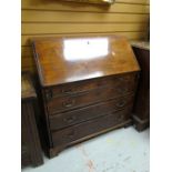 An antique mahogany bureau having four graduated drawers & pigeon hole / drawer interior Condition