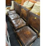 A set of four vintage buttoned leather dining chairs, a vintage elbow chair & another Condition